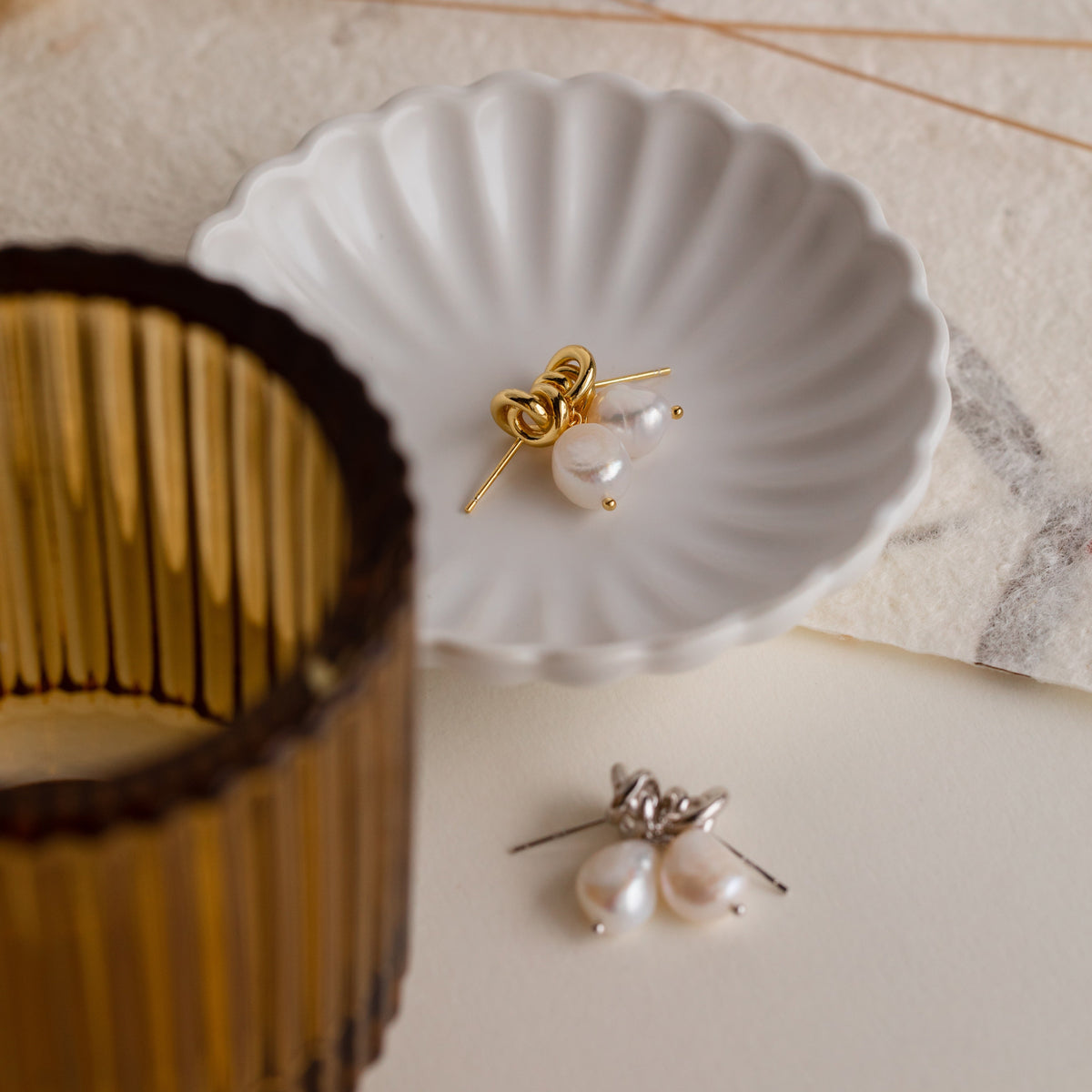 Knot pearl drop earrings