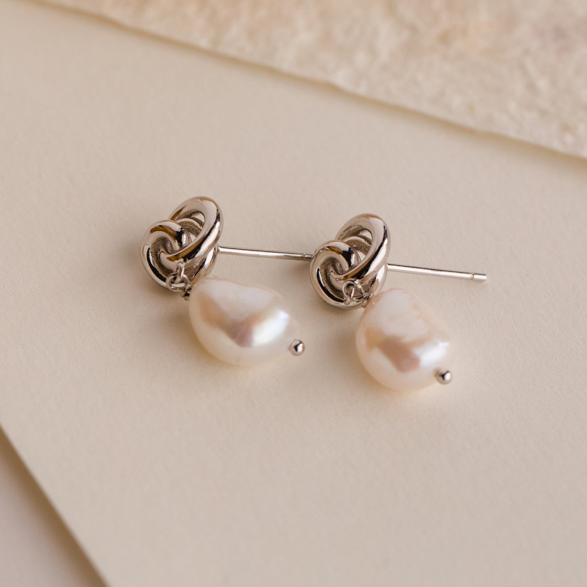 Knot pearl drop earrings