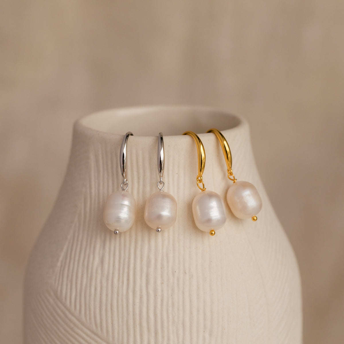 Dangling pearl drop earrings