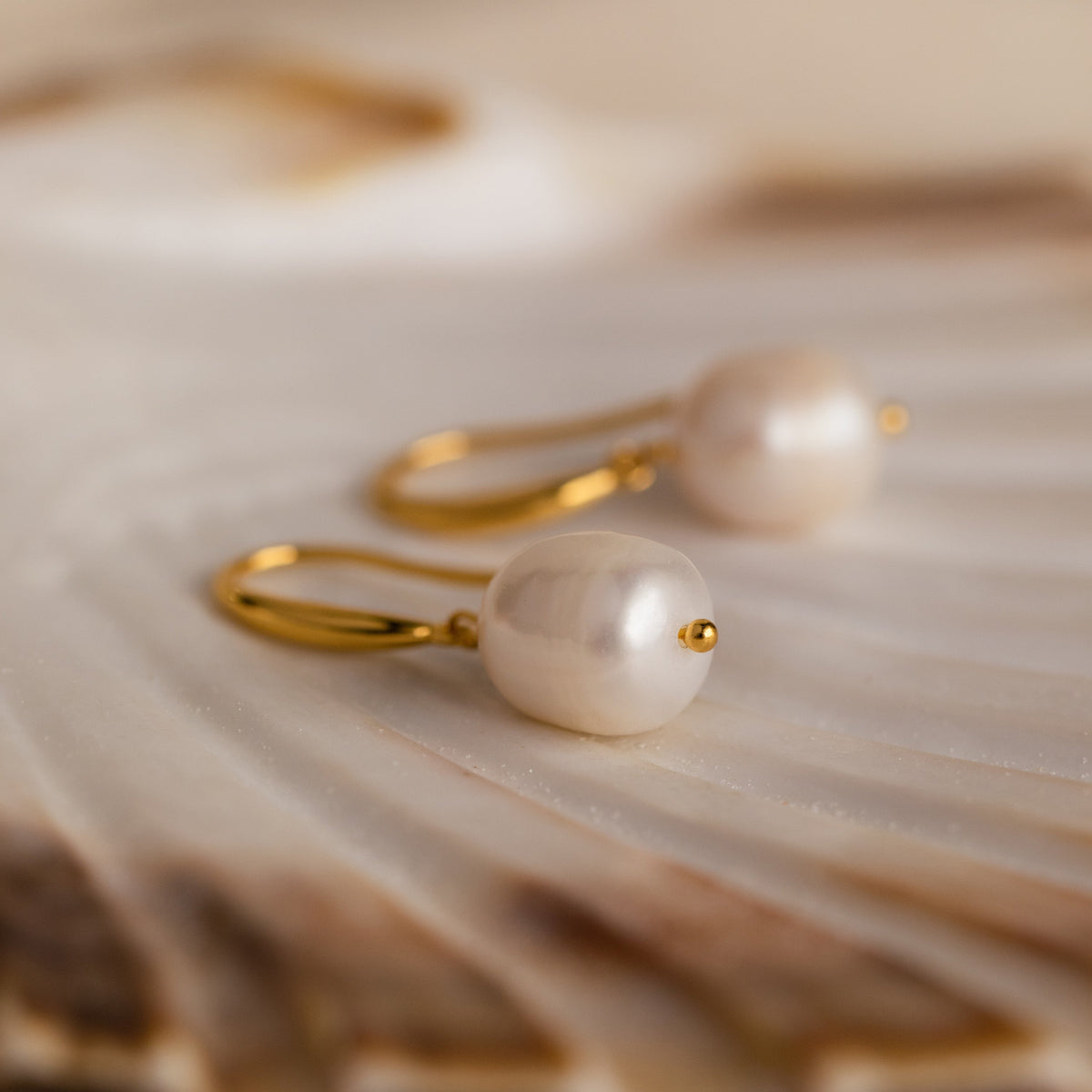 Dangling pearl drop earrings
