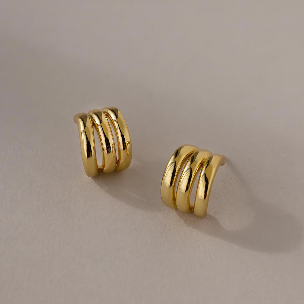 Triple loop huggie earrings