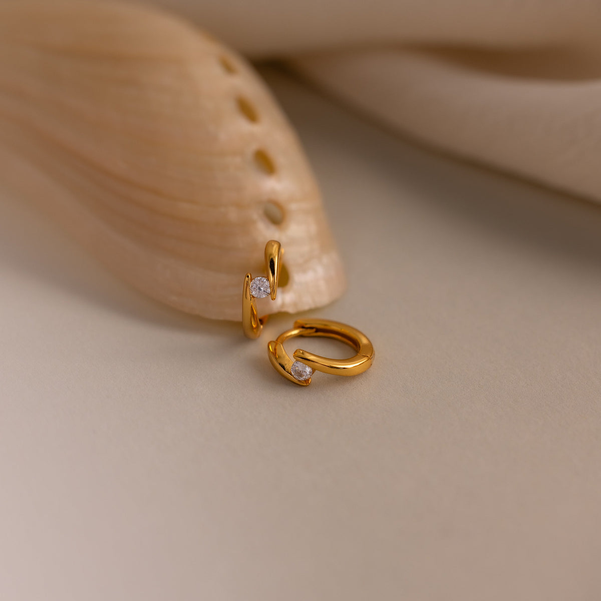 Floating birthstone huggies