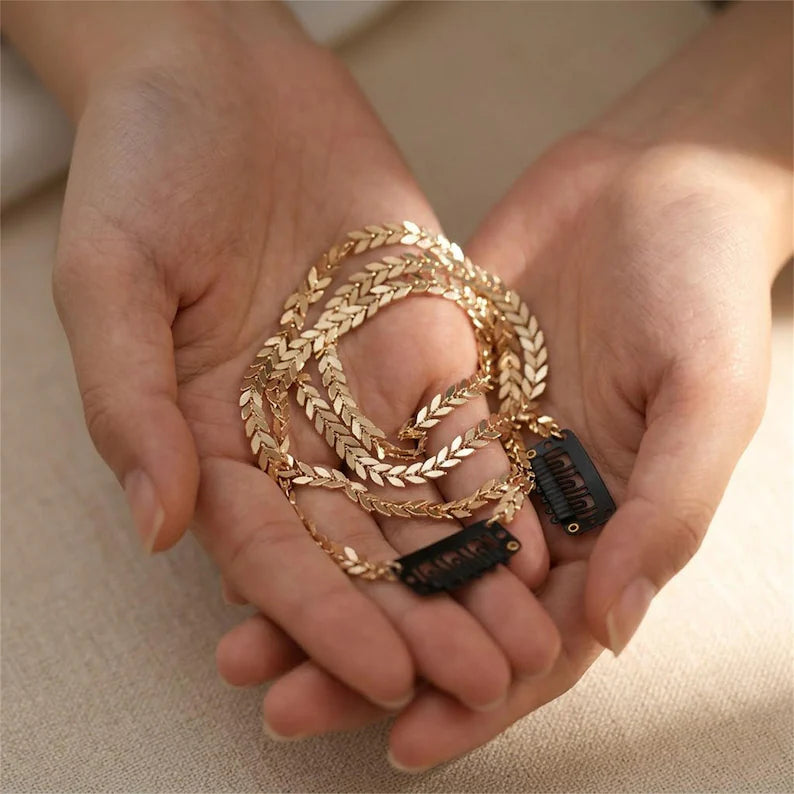Gold leaf hair vine and clips shown in hands