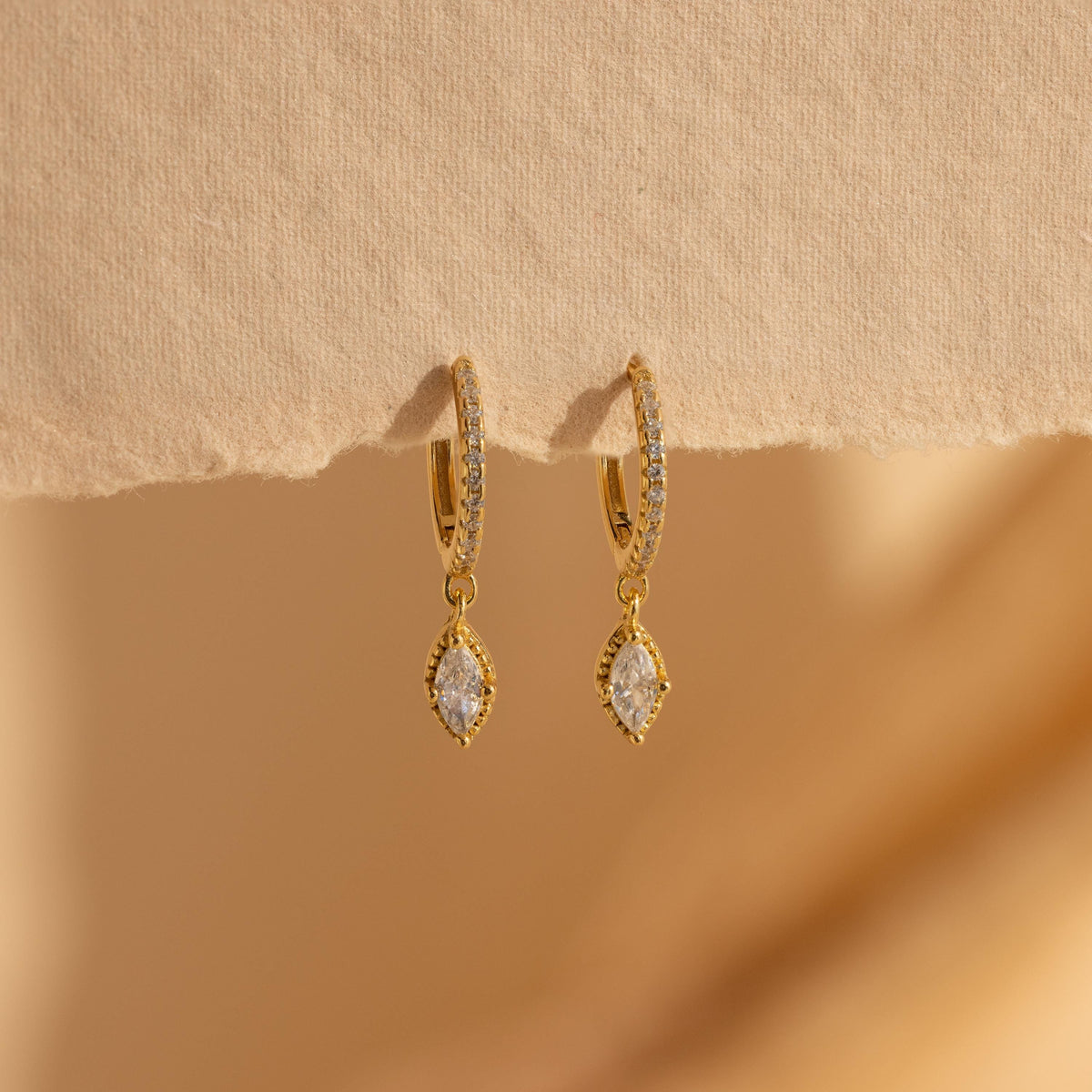 Marquise pave drop huggies