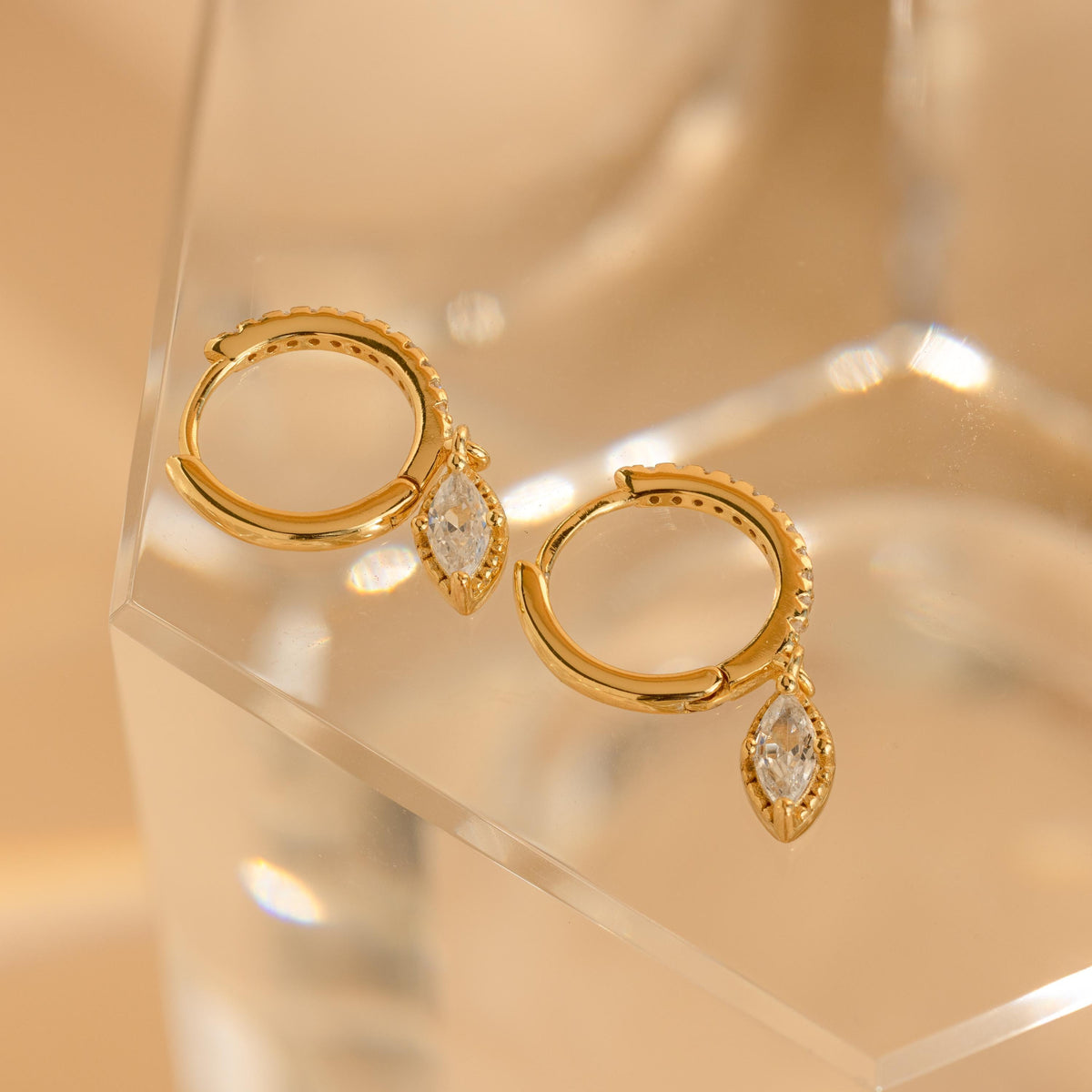 Marquise pave drop huggies