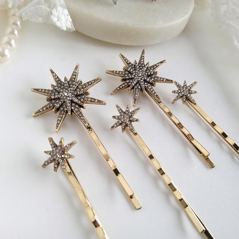 Gold Star Hair Pins on a white surface