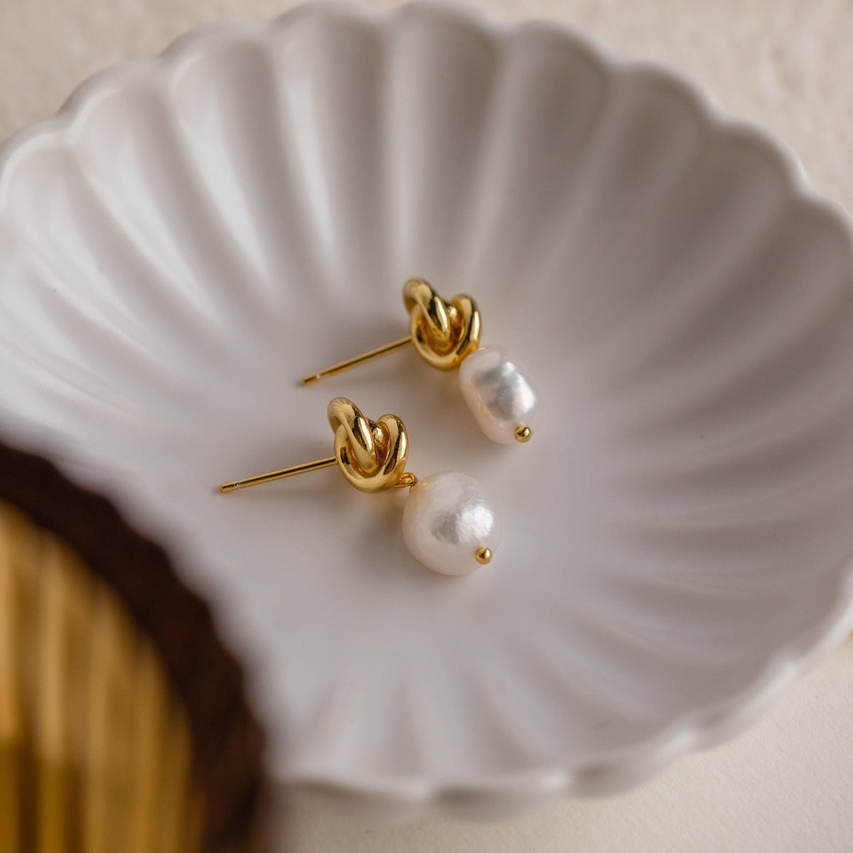 Knot pearl drop earrings