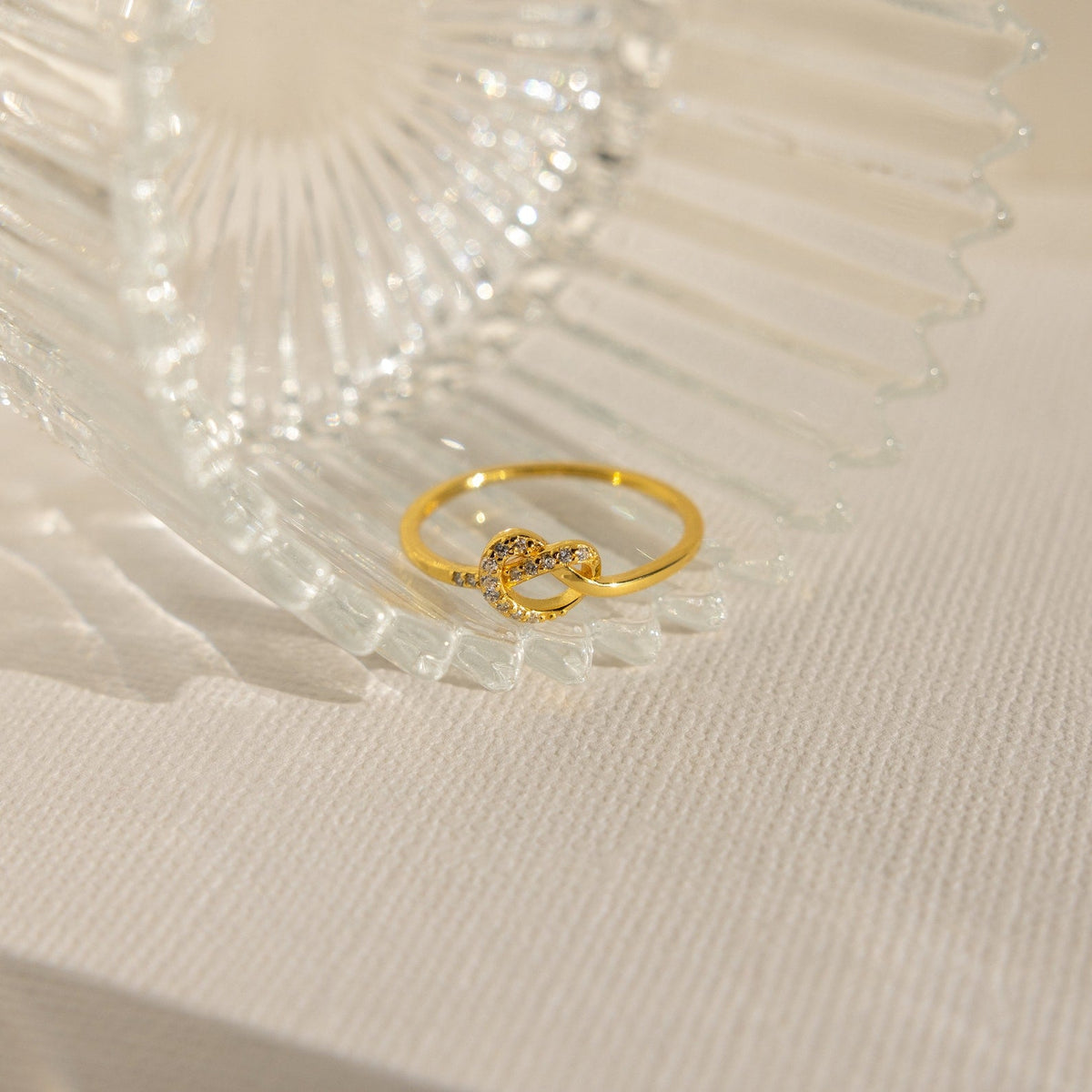 Pave heart knot ring
