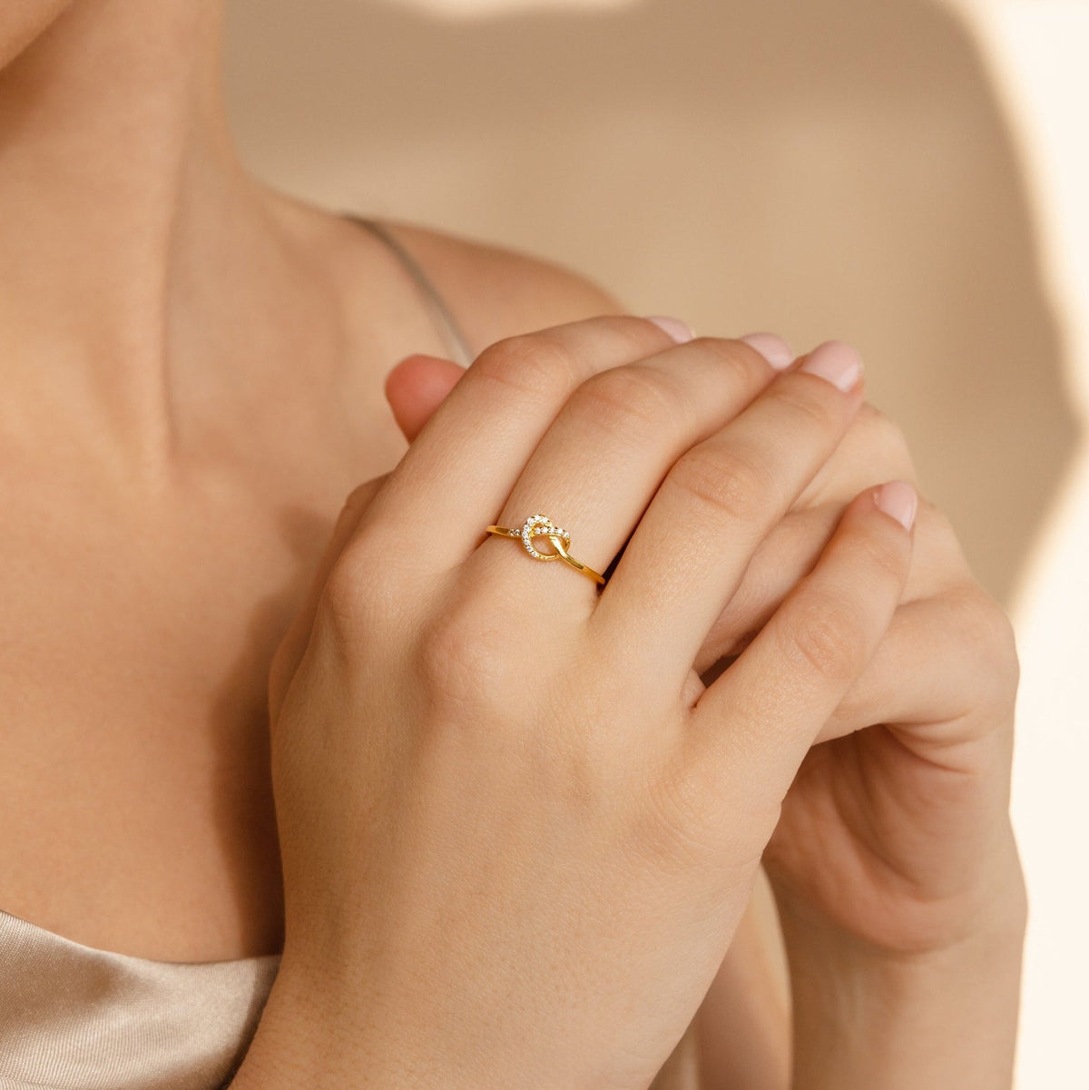 Pave heart knot ring