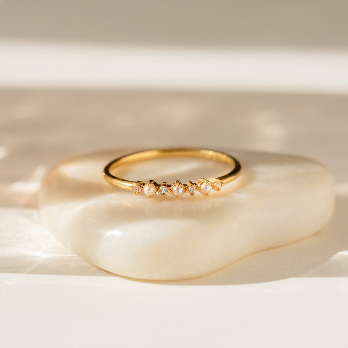 Delicate pearl diamond ring