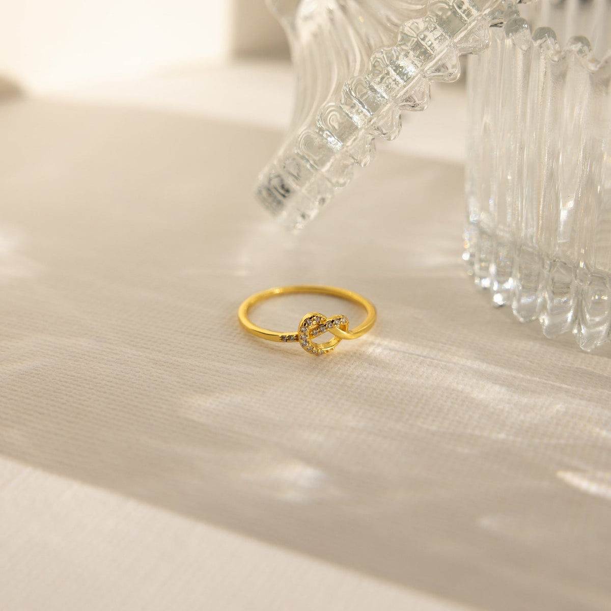 Pave heart knot ring