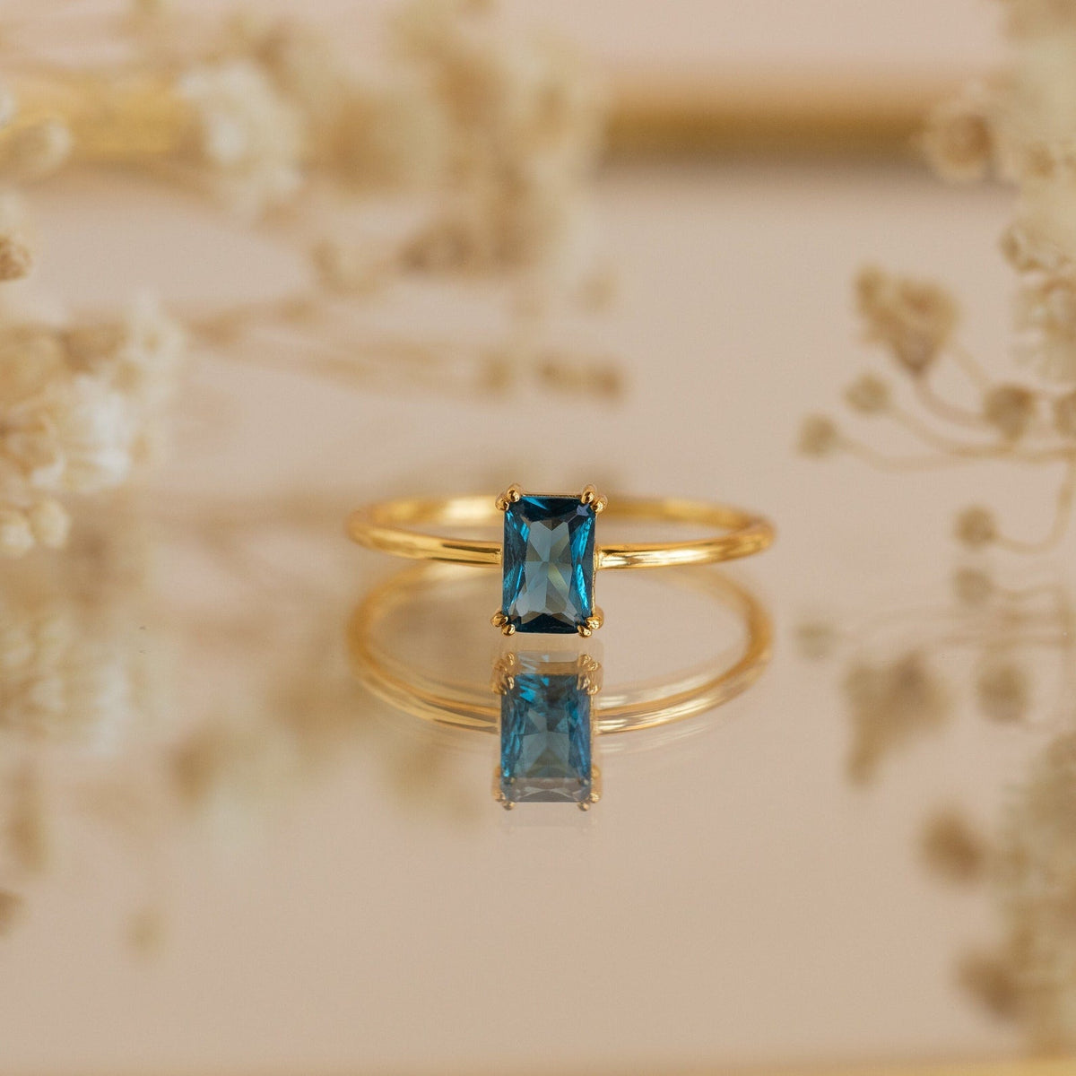 Blue topaz emerald-cut ring