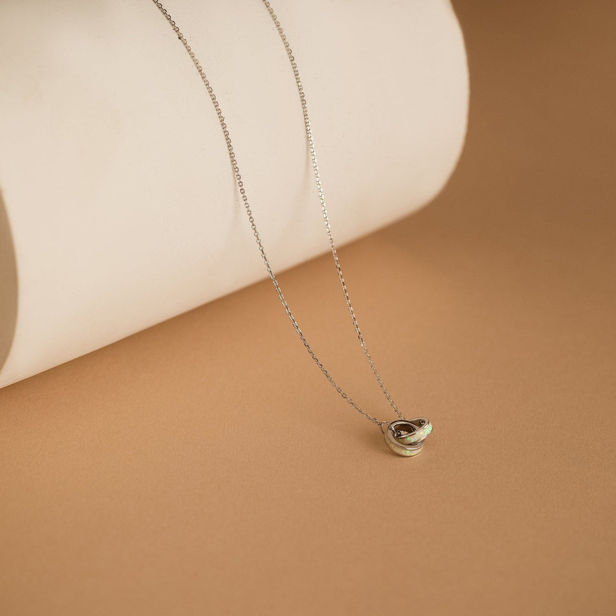 Interlocking opal inlay necklace