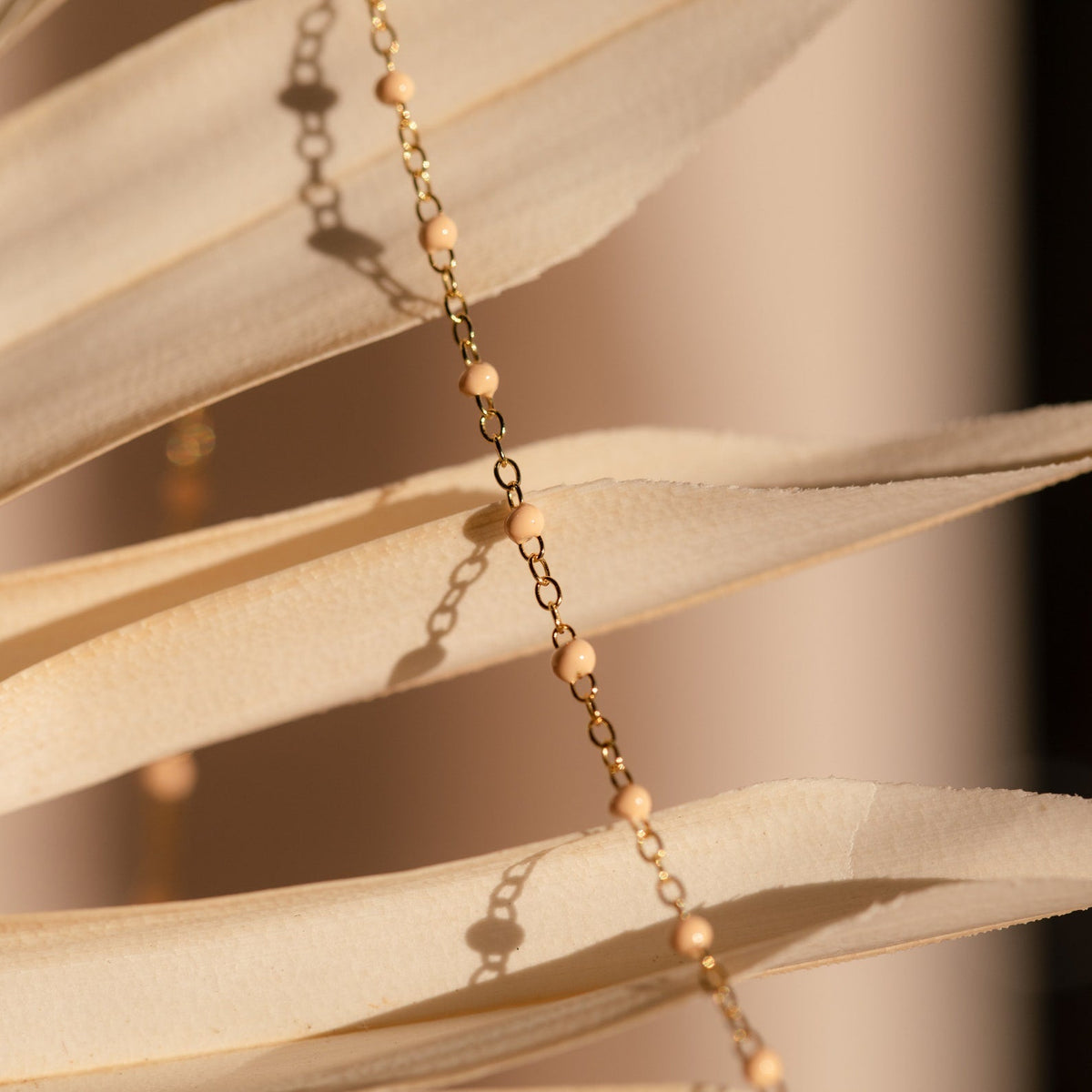 Peach station necklace