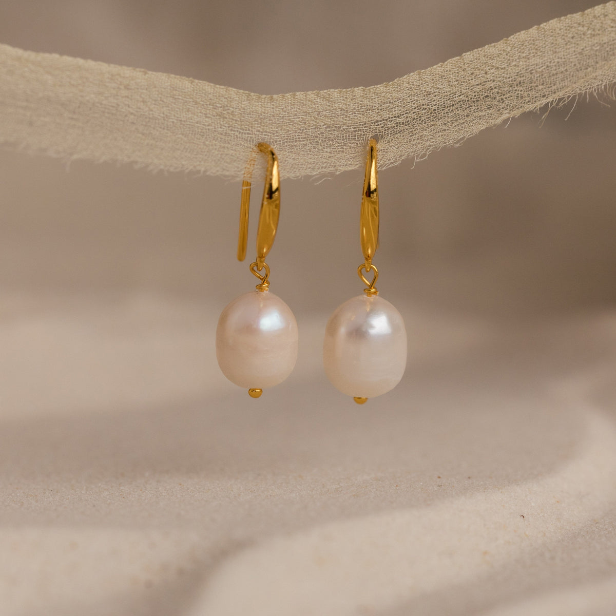 Dangling pearl drop earrings