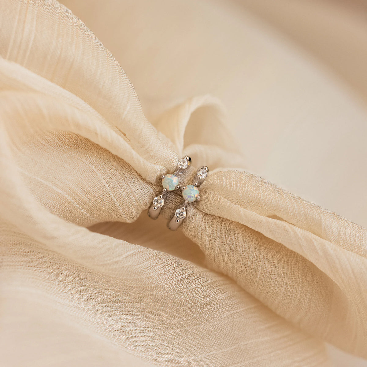 Dainty opal diamond huggies