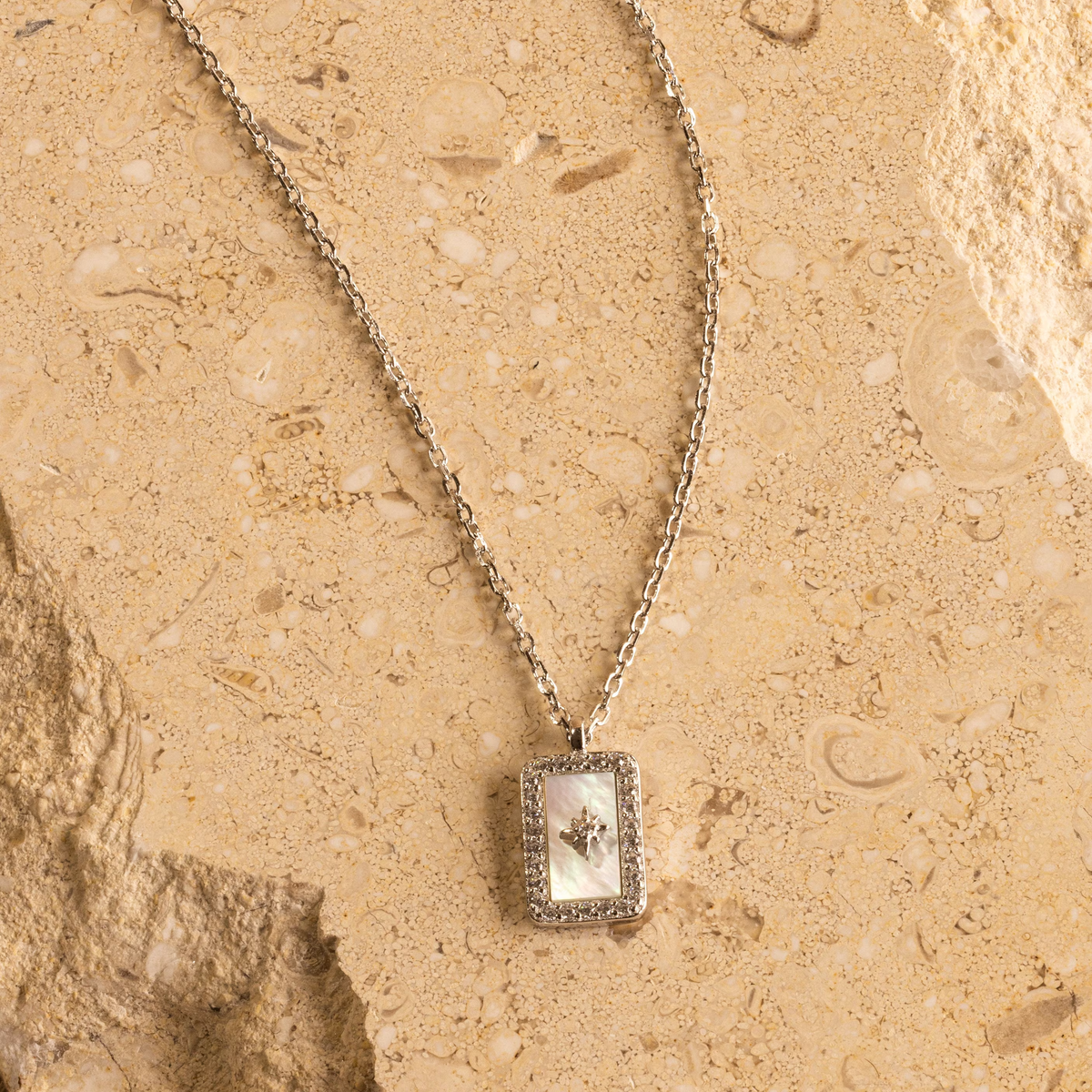 Pave pearl north star necklace