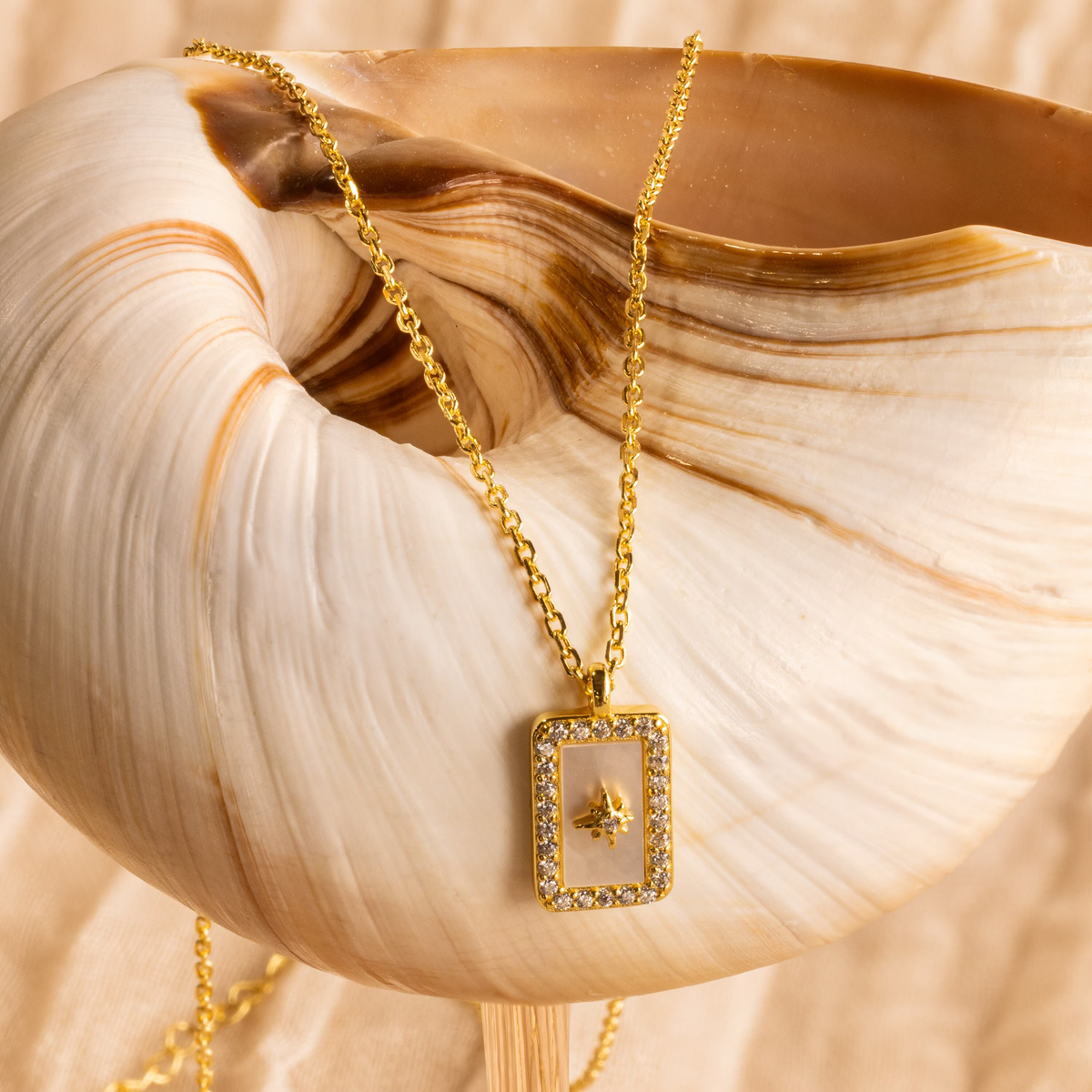 Pave pearl north star necklace