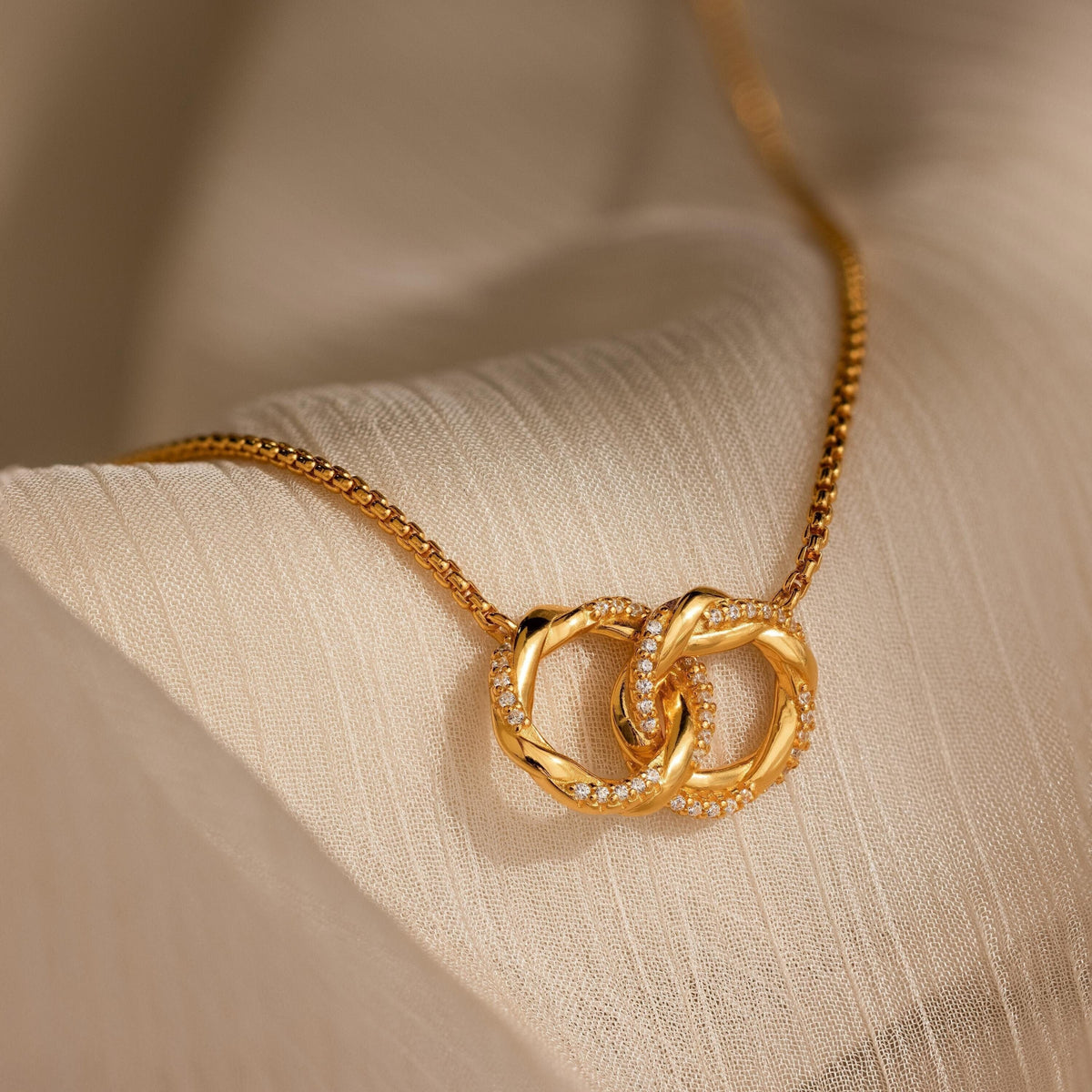 Interlocking pave charm necklace