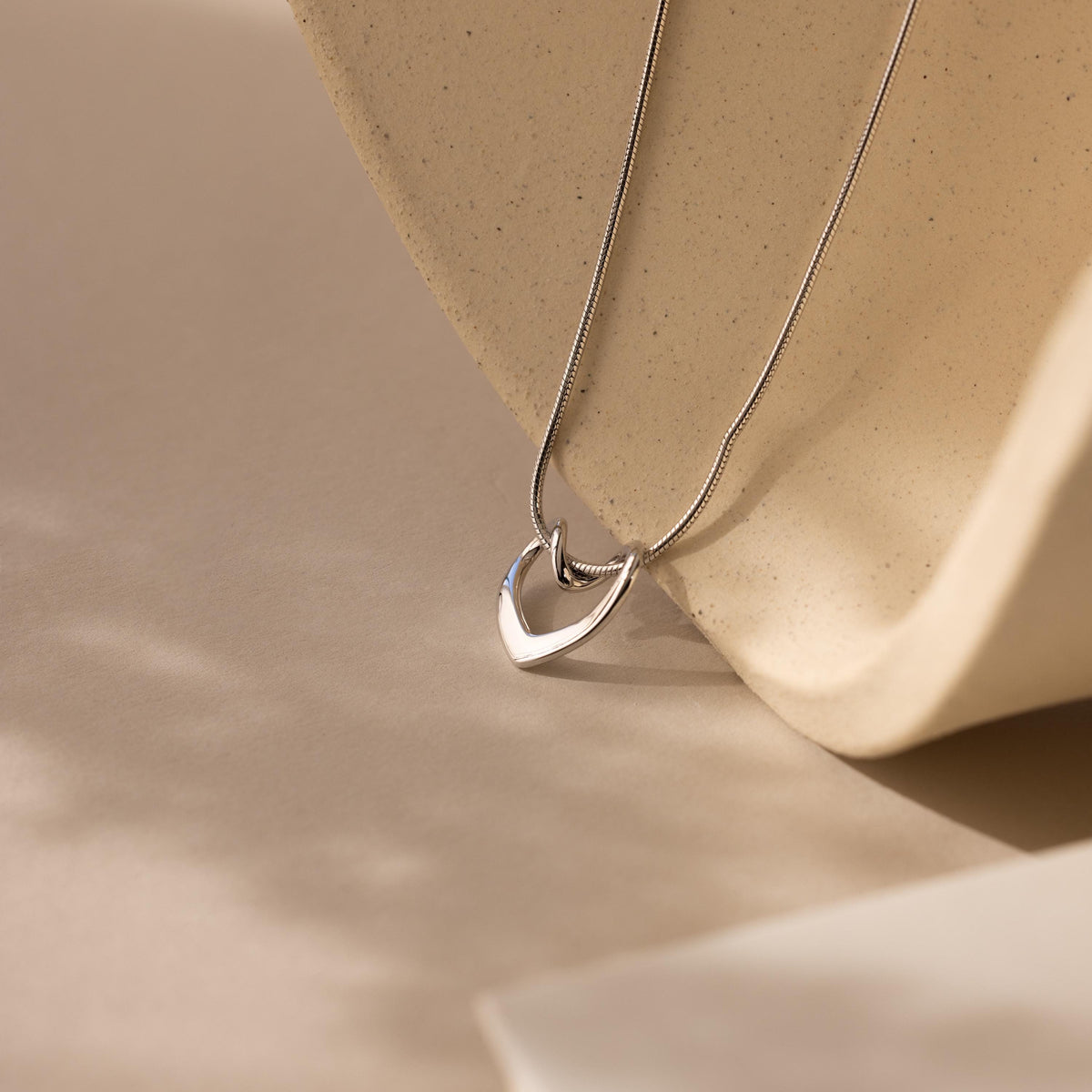 Heart knot necklace