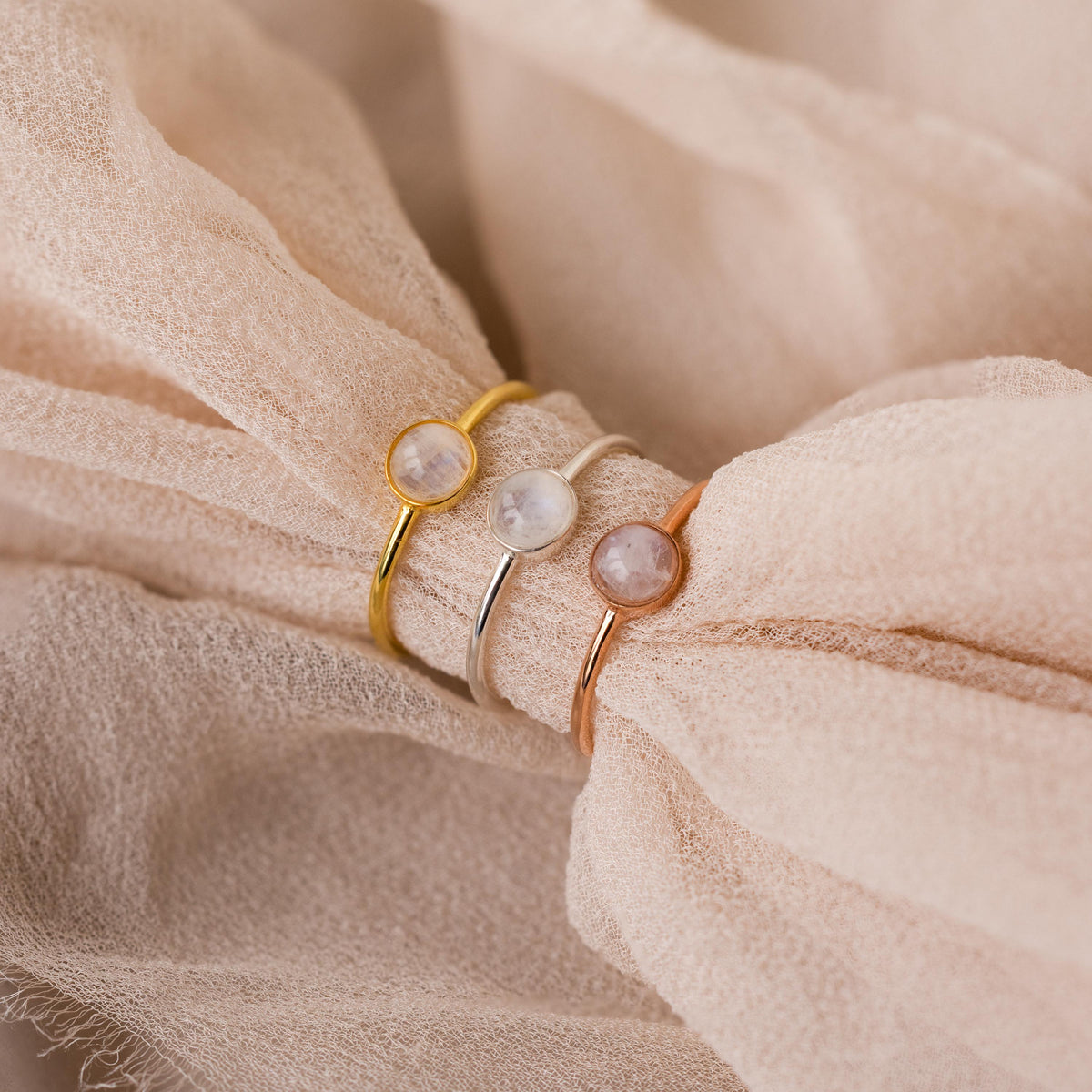 Dainty round moonstone ring