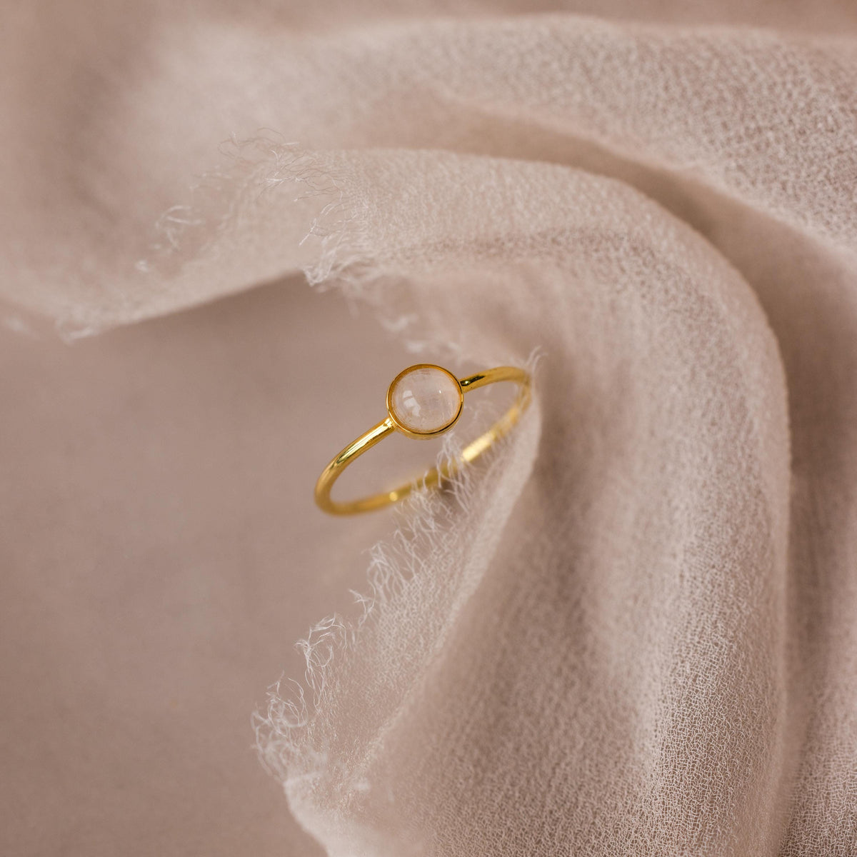 Dainty round moonstone ring