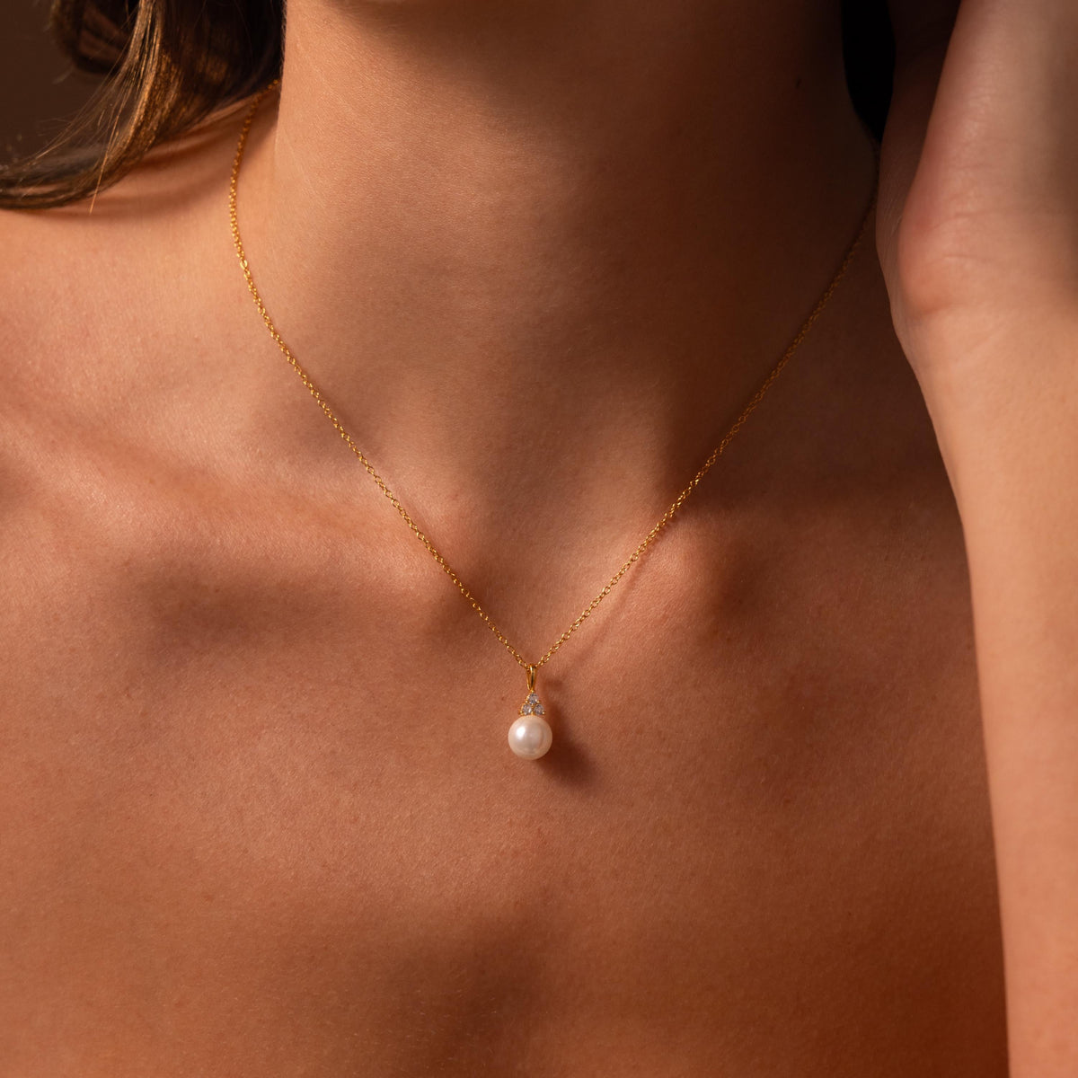 Diamond halo pearl necklace