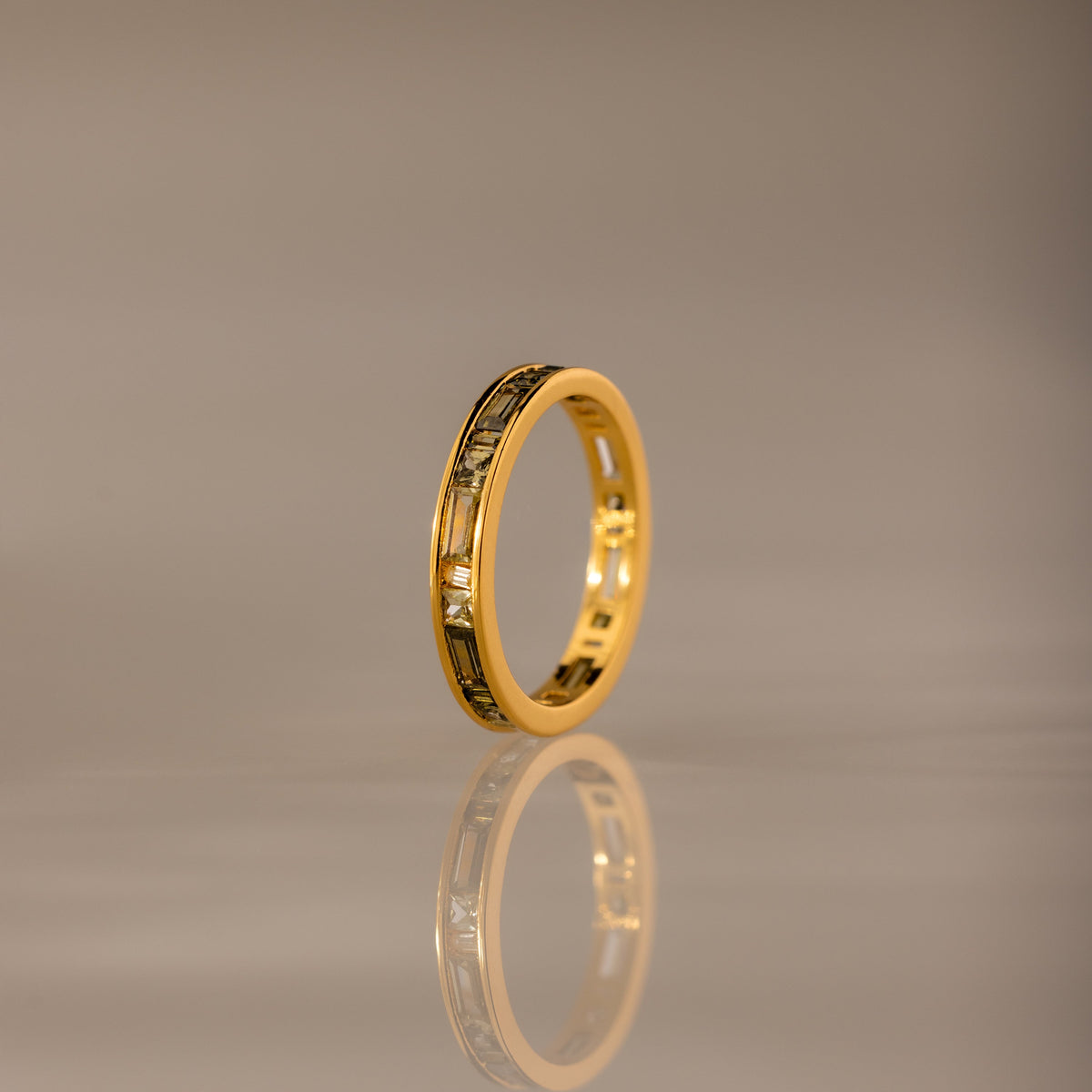Peridot inlay eternity ring